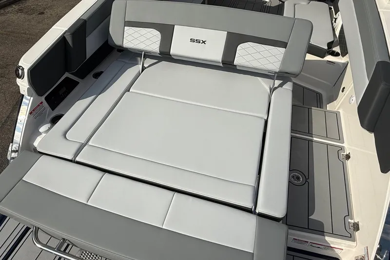 Slide: The Image of 2025 Chaparral 2870 SSX boat with spacious, cushioned seating area. - 16