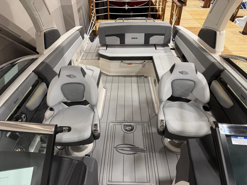 Slide: The Image of 2025 Chaparral 2870 SSX boat interior with sleek seating and modern dashboard. - 5