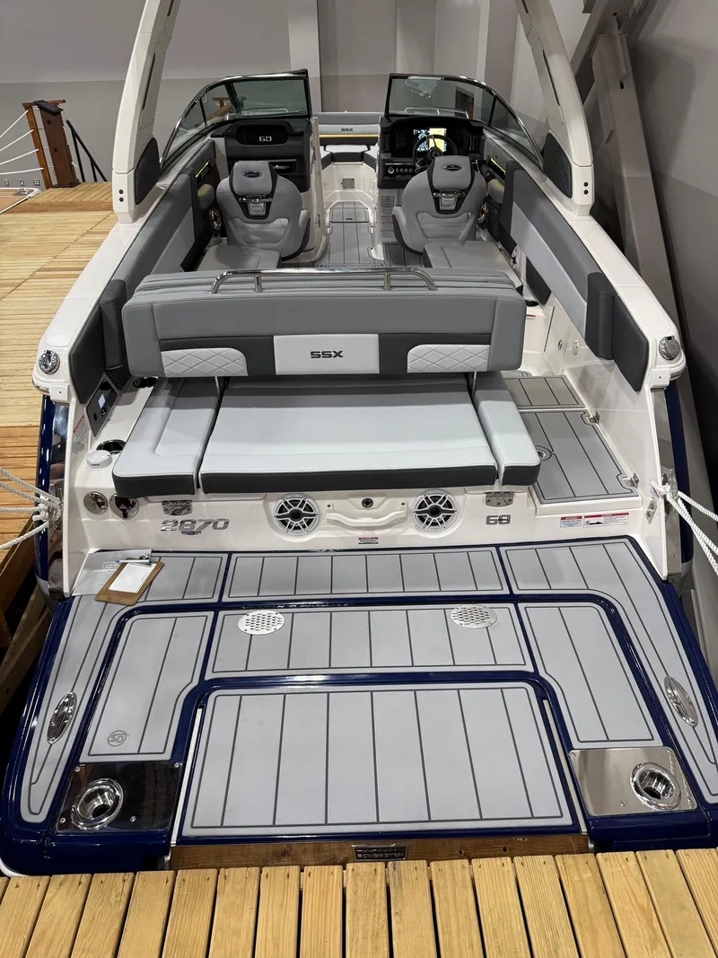 Slide: The Image of 2025 Chaparral 2870 SSX boat interior with sleek seating and modern dashboard design. - 6