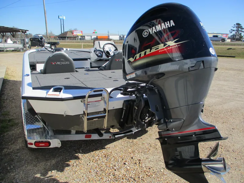 Slide: The Image of 2025 Vexus AVX 1980 boat with Yamaha VMAX engine, parked outdoors. - 13