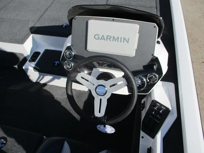 Slide: The Image of 2025 Vexus AVX 1980 boat dashboard with Garmin navigation system and steering wheel. - 5