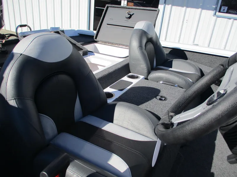 Slide: The Image of 2025 Vexus AVX 1980 boat interior with black and gray seating and storage compartments. - 6