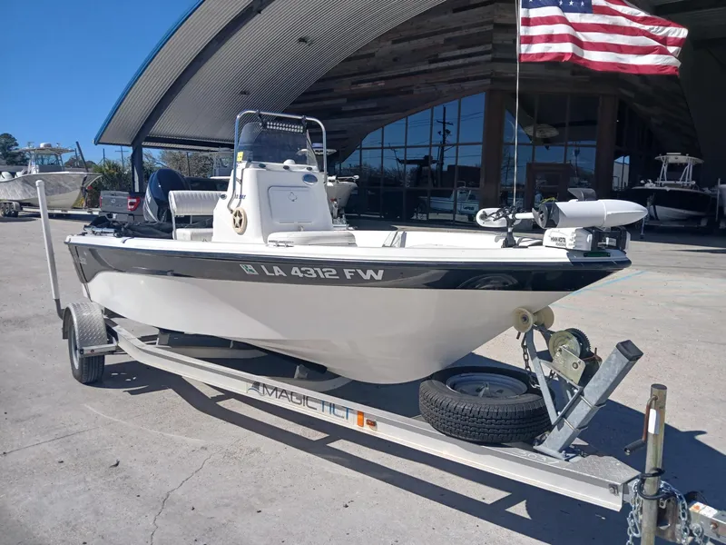 Slide: The Image of 2010 NauticStar 1810 boat on trailer with American flag in background. - 11