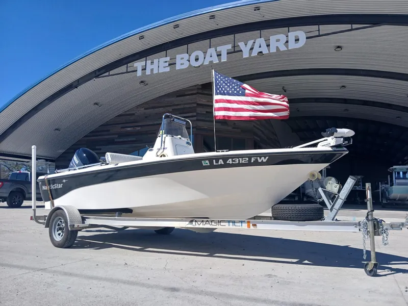 Slide: The Image of 2010 NauticStar 1810 boat with American flag at The Boat Yard. - 15