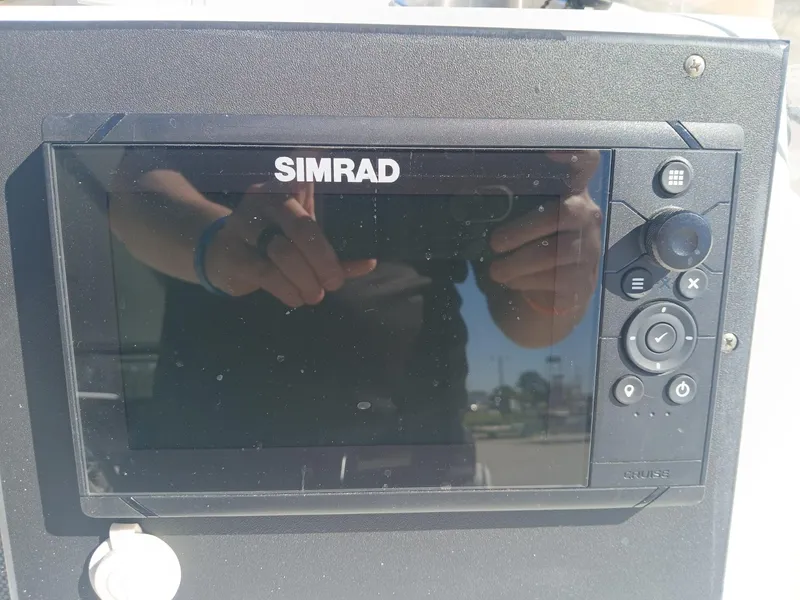 Slide: The Image of Simrad marine display on 2010 NauticStar 1810 boat dashboard. - 4