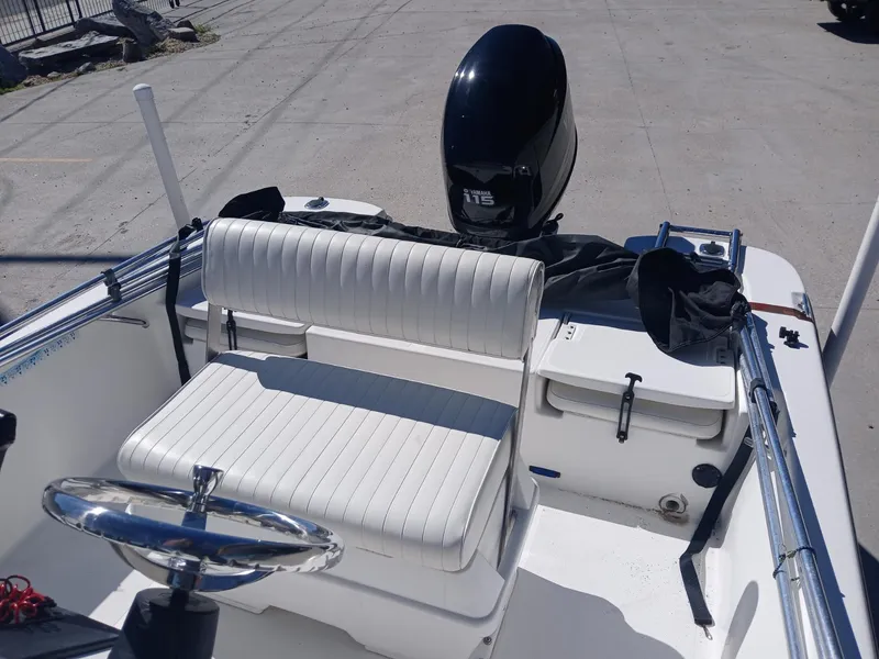 Slide: The Image of 2010 NauticStar 1810 boat interior with steering wheel and outboard motor. - 6