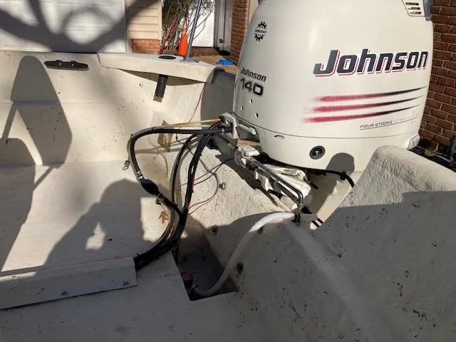 Slide: The Image of 1997 Carolina Skiff 198 DLV with Johnson 140 outboard motor, interior view. - 2