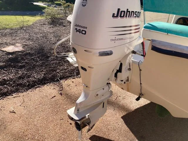 Slide: The Image of Johnson 140 outboard motor on 1997 Carolina Skiff 198 DLV boat. - 5