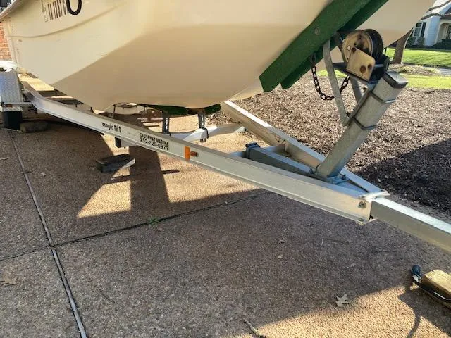 Slide: The Image of 1997 Carolina Skiff 198 DLV on a trailer, parked on a paved surface. - 6