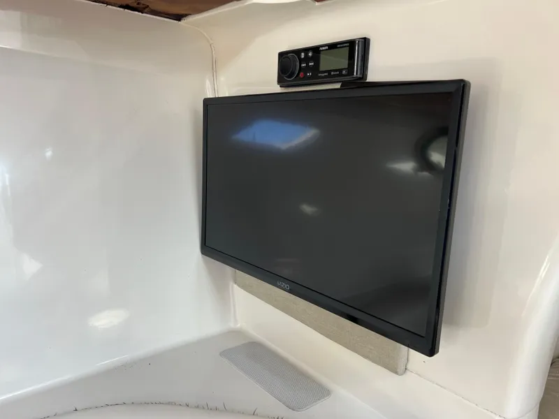 Slide: The Image of Flat-screen TV and stereo system in 1996 Silverton 310 Express boat interior. - 25