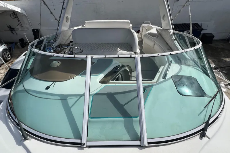 Slide: The Image of 1996 Silverton 310 Express boat with spacious cockpit and clear windshield. - 27