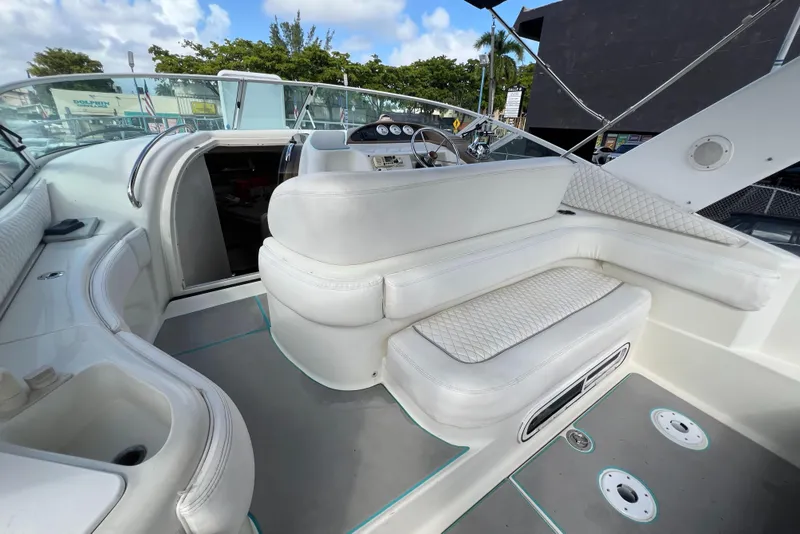 Slide: The Image of 1996 Silverton 310 Express boat interior with white seating and dashboard. - 31