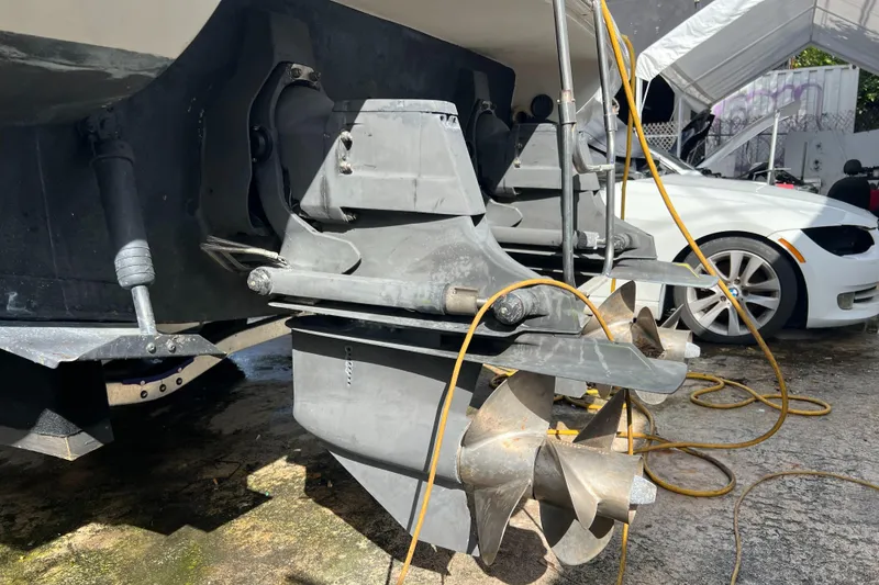 Slide: The Image of 1996 Silverton 310 Express boat propeller and stern drive in maintenance area. - 38