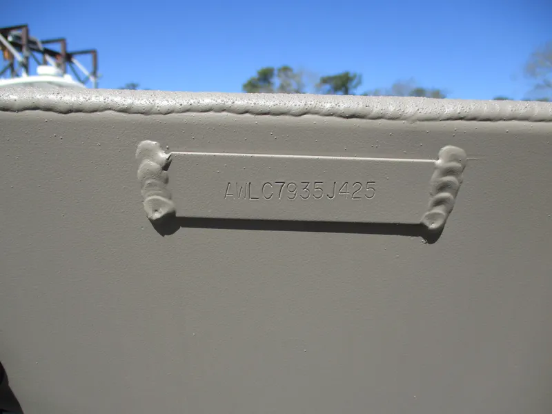 Slide: The Image of 2025 Alweld 1752PF boat hull identification number on metal surface. - 11