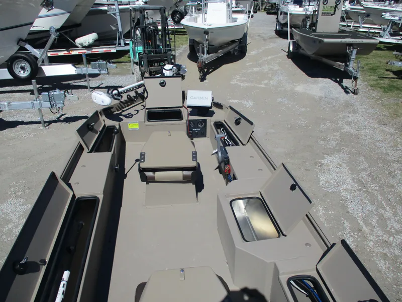 Slide: The Image of 2025 Alweld 1752PF boat interior with storage compartments and seating, displayed outdoors. - 7