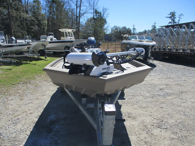 Slide: The Image of 2025 Alweld 1752PF boat on trailer, parked outdoors in a boatyard. - 9