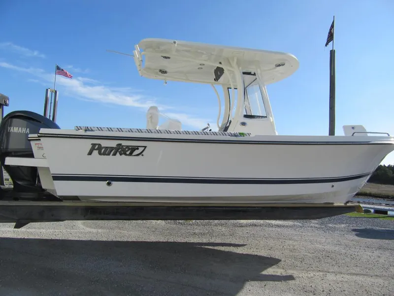 The Image of 2025 Parker 2200 Center Console boat on trailer, clear sky background. - 1