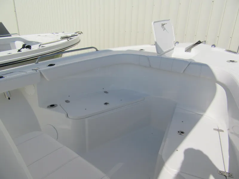 Slide: The Image of 2025 Parker 2200 Center Console boat interior with open storage compartment. - 8