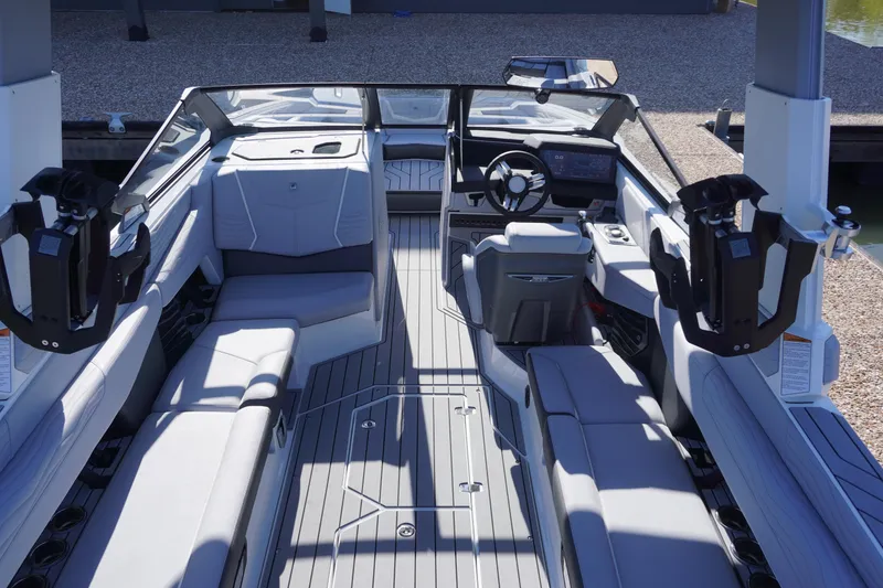 Slide: The Image of 2025 Nautique Super Air Nautique G25 interior with sleek seating and modern dashboard. - 3