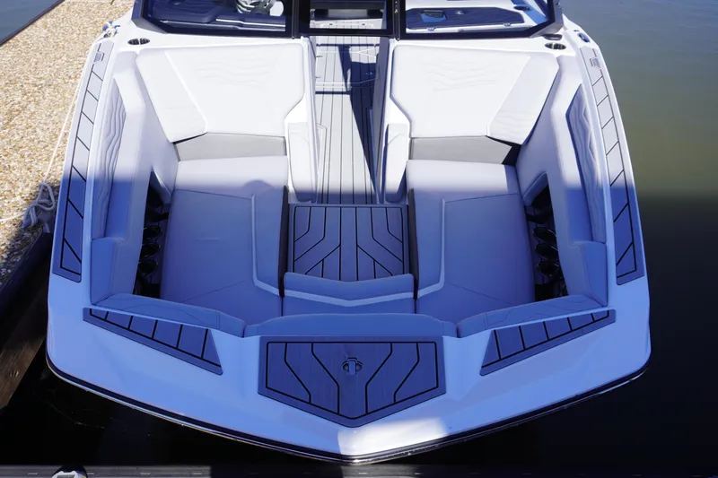 Slide: The Image of 2025 Nautique Super Air Nautique G25 boat interior with sleek, modern seating design. - 9