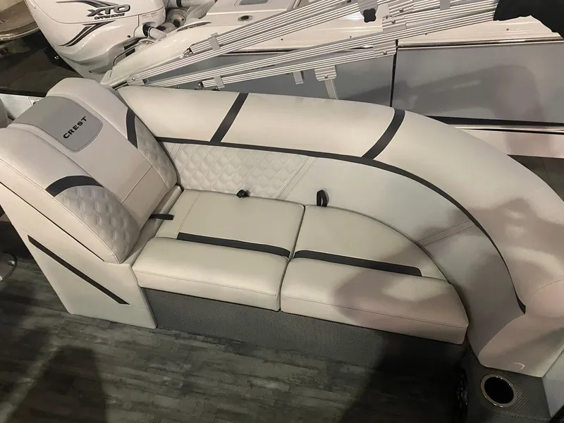 Slide: The Image of 2023 Crest Classic DLX 240 boat seating with elegant upholstery and modern design. - 13