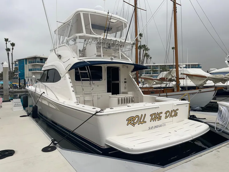 Slide: The Image of 2005 Riviera 47 Open Flybridge Series II yacht docked at marina. - 16