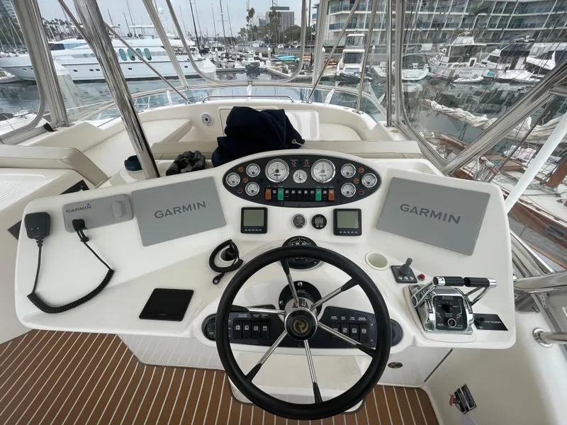 Slide: The Image of Helm of 2005 Riviera 47 Open Flybridge Series II with Garmin navigation systems. - 19