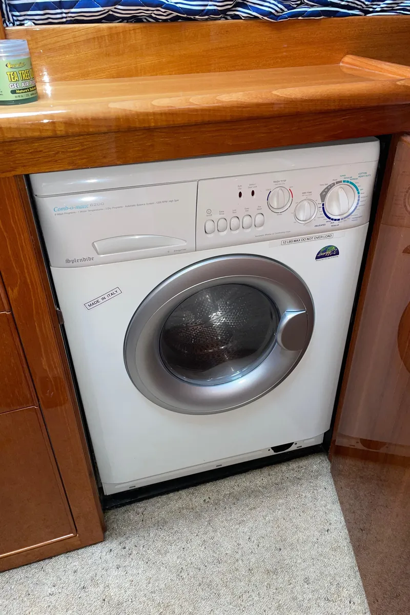 Slide: The Image of Washing machine inside 2005 Riviera 47 Open Flybridge Series II yacht interior. - 32