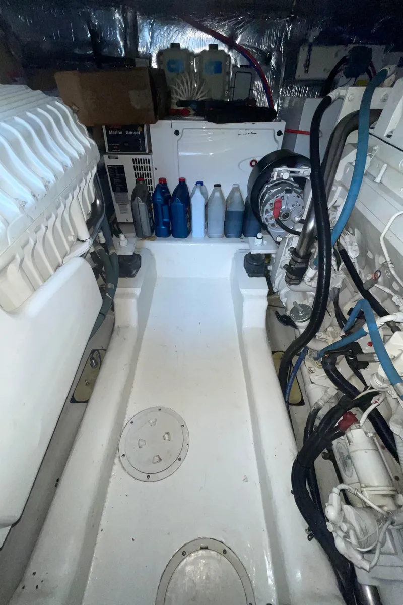 Slide: The Image of Engine room of 2005 Riviera 47 Open Flybridge Series II with visible machinery and equipment. - 38