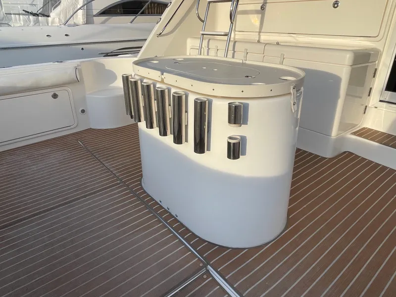 Slide: The Image of 2005 Riviera 47 Open Flybridge Series II yacht interior with rod holders and seating. - 39