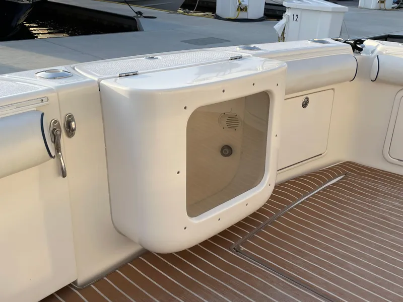 Slide: The Image of 2005 Riviera 47 Open Flybridge Series II boat deck with storage compartment. - 40