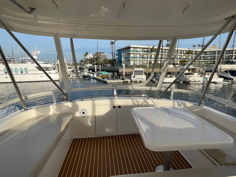 Slide: The Image of 2005 Riviera 47 Open Flybridge Series II, marina view from flybridge seating area. - 41