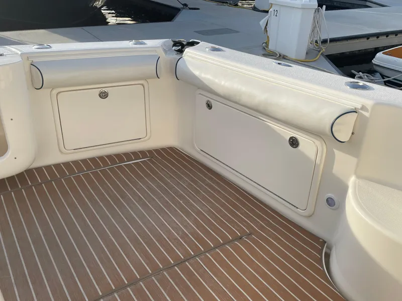 Slide: The Image of 2005 Riviera 47 Open Flybridge Series II boat deck with storage compartments. - 45