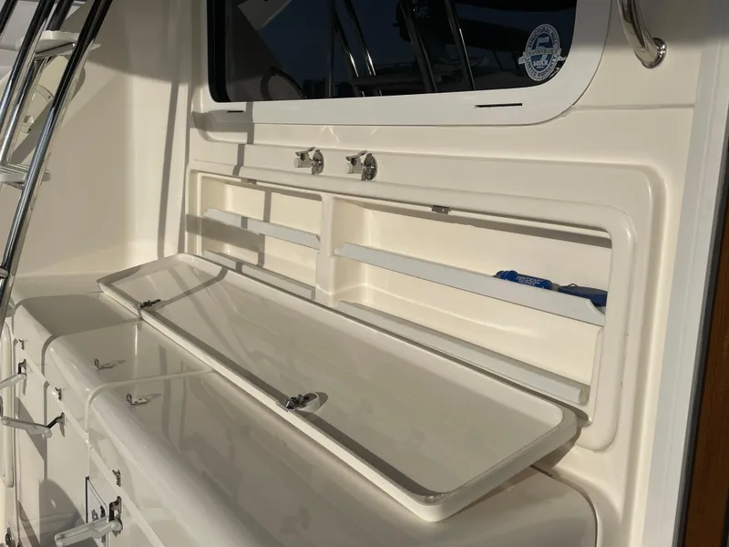 Slide: The Image of 2005 Riviera 47 Open Flybridge Series II yacht interior with storage compartments. - 48