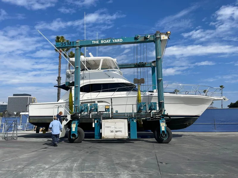 Slide: The Image of 2005 Riviera 47 Open Flybridge Series II yacht at boatyard lift. - 6