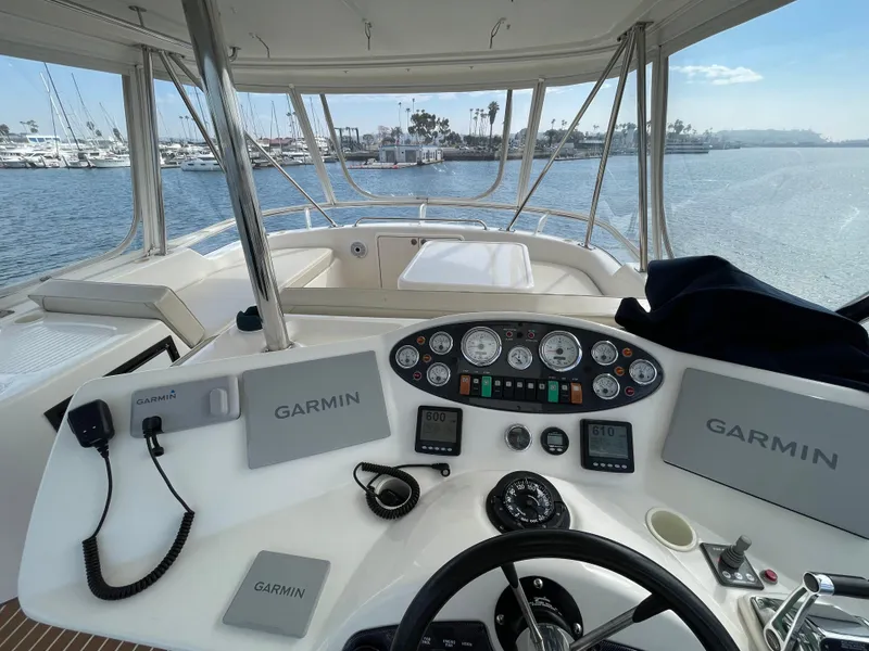 Slide: The Image of Helm of 2005 Riviera 47 Open Flybridge Series II with Garmin navigation system. - 7