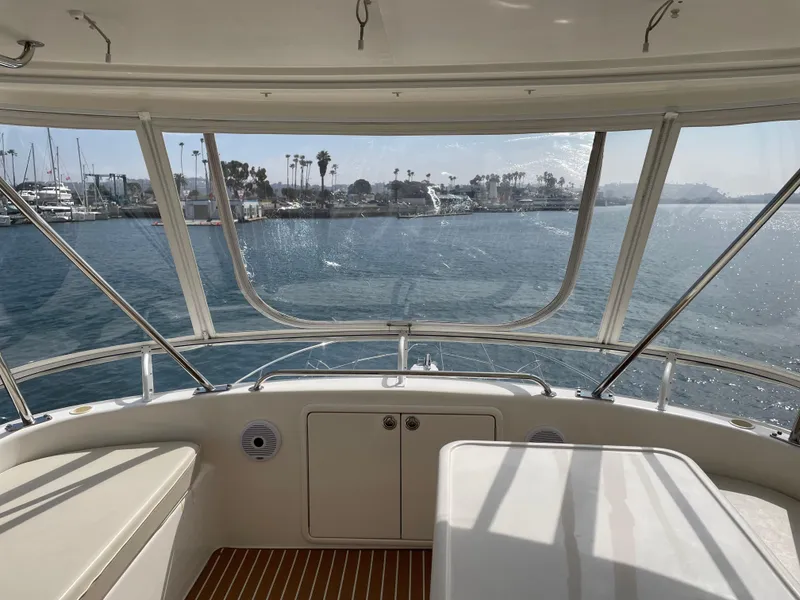 Slide: The Image of Interior view from 2005 Riviera 47 Open Flybridge Series II, overlooking marina. - 8