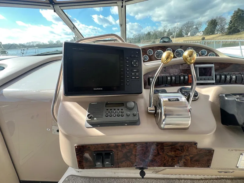 Slide: The Image of Control panel of a 2001 Sea Ray 340 Sundancer boat with navigation equipment. - 10
