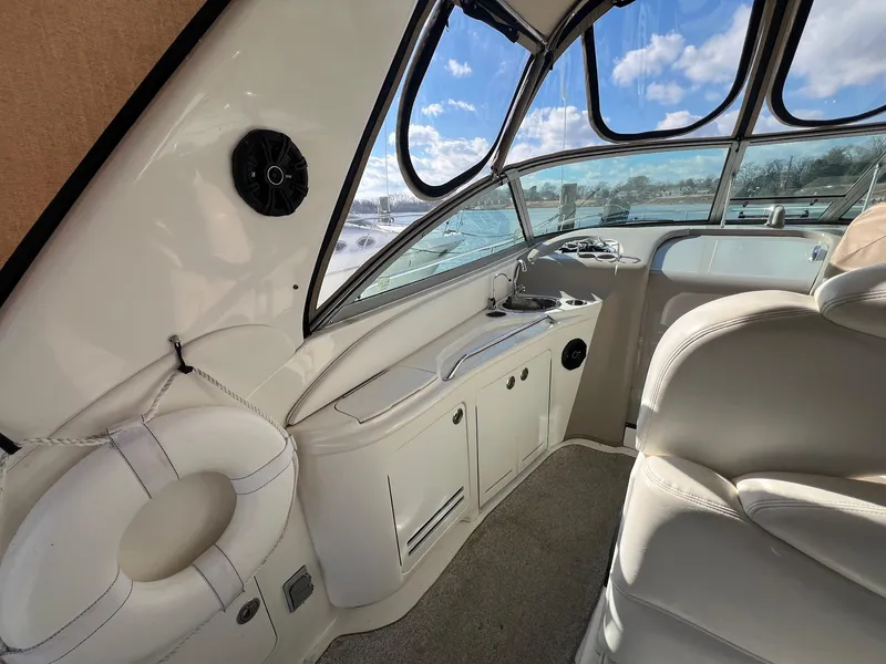 Slide: The Image of Interior of 2001 Sea Ray 340 Sundancer boat with seating and windows. - 15