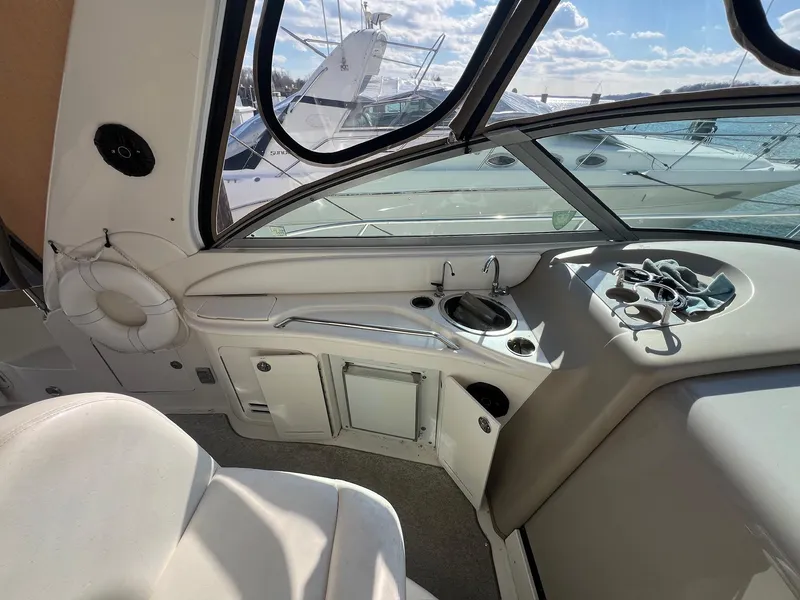 Slide: The Image of Interior view of 2001 Sea Ray 340 Sundancer boat cockpit with helm and seating. - 16