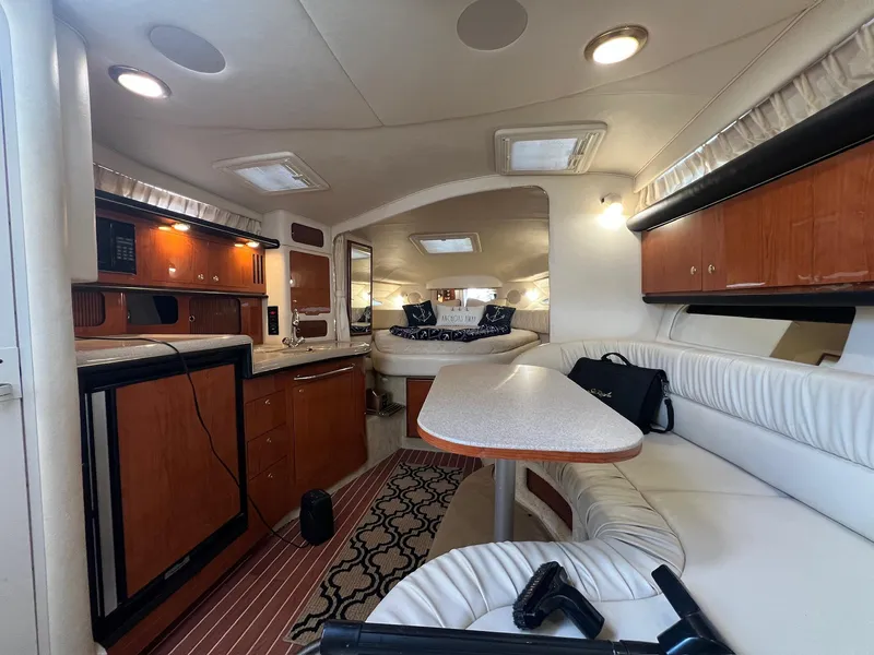 Slide: The Image of Interior of 2001 Sea Ray 340 Sundancer yacht with kitchen and seating area. - 20