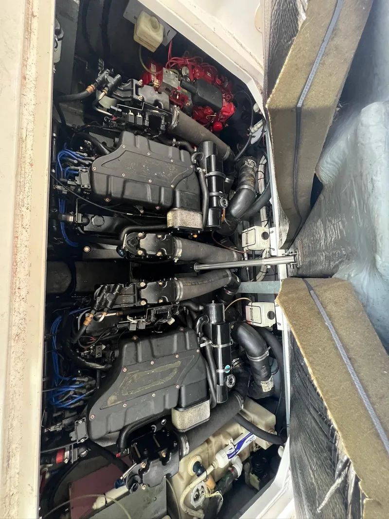Slide: The Image of Engine compartment of a 2001 Sea Ray 340 Sundancer boat, showcasing dual engines. - 30