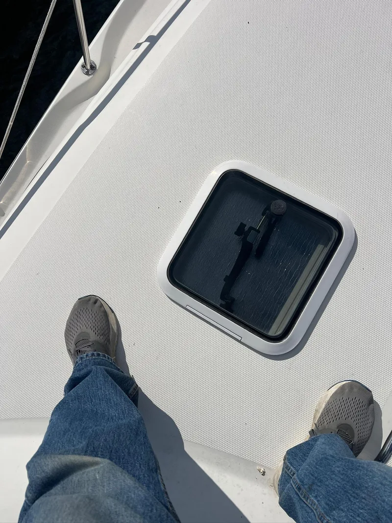 Slide: The Image of Person standing on 2001 Sea Ray 340 Sundancer deck near hatch. - 34