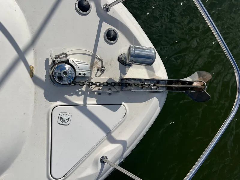 Slide: The Image of Anchor and chain mechanism on a 2001 Sea Ray 340 Sundancer boat deck. - 35