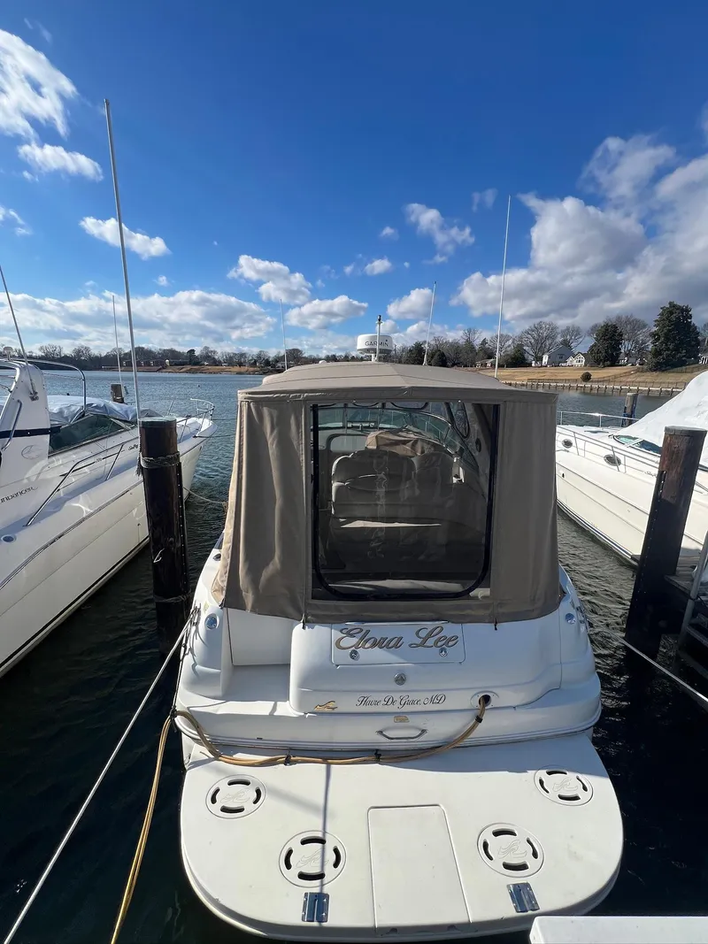 Slide: The Image of 2001 Sea Ray 340 Sundancer docked under a clear blue sky. - 4