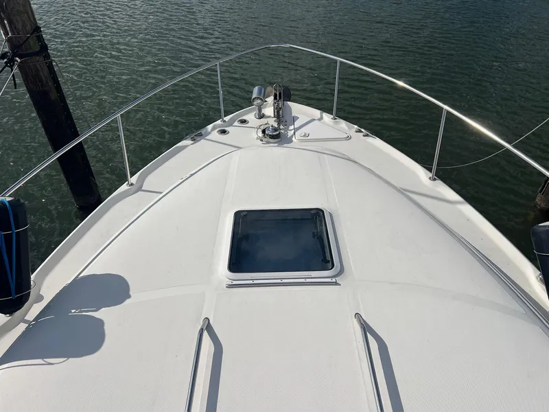 Slide: The Image of Bow view of 2001 Sea Ray 340 Sundancer yacht on water. - 40