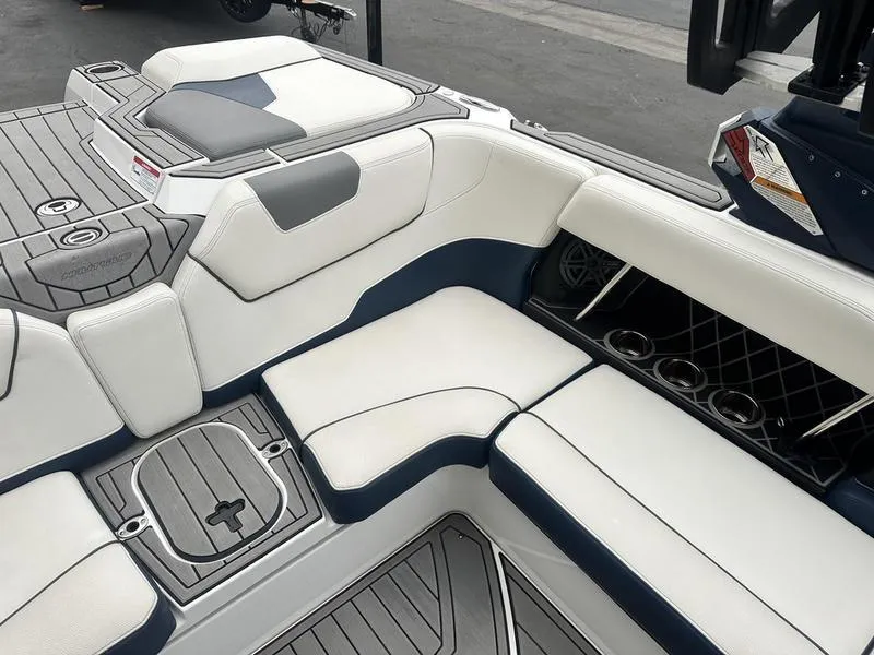 Slide: The Image of 2019 Nautique Super Air Nautique GS22 interior with white and gray seating. - 10