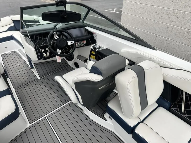 Slide: The Image of 2019 Nautique Super Air Nautique GS22 interior with sleek design and modern dashboard. - 12