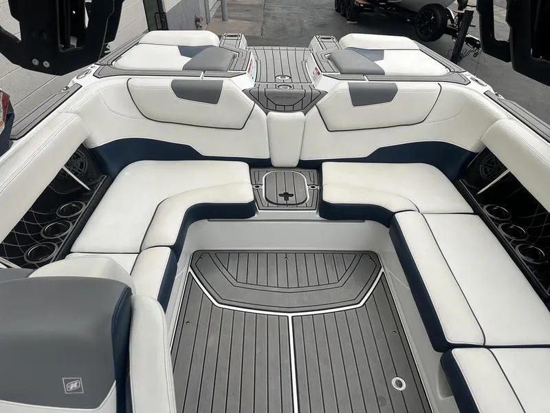 Slide: The Image of 2019 Nautique Super Air Nautique GS22 interior with white and gray seating. - 8