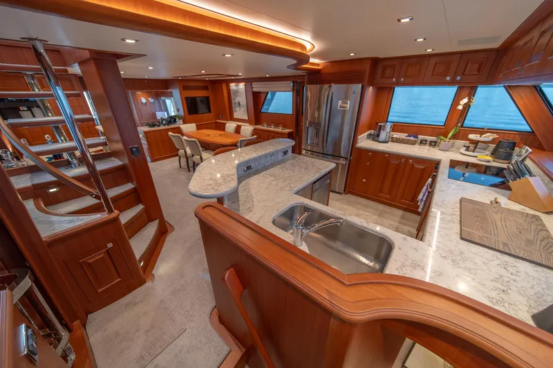 Slide: The Image of Luxurious interior of 2022 Hampton Endurance 750 LRC yacht with modern kitchen and dining area. - 13